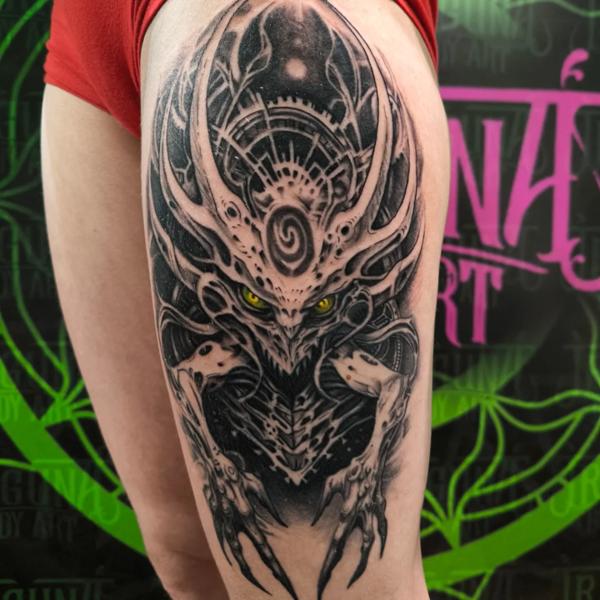 Realism alien creature tattoo by @outcast.tattoo.budapest