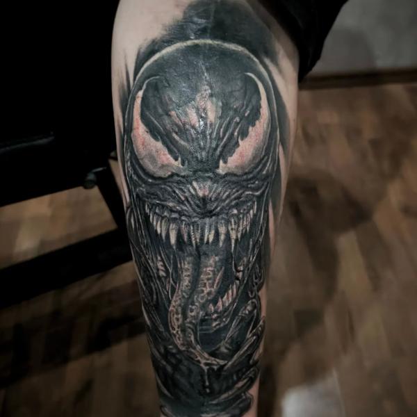 Realism venom face tattoo by @outcast.tattoo.budapest