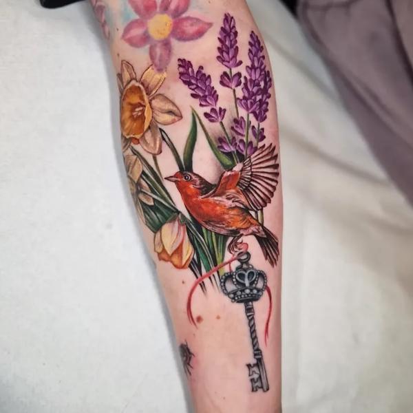 Realism bird and flowers tattoo by @paigehutchinson_tattoo