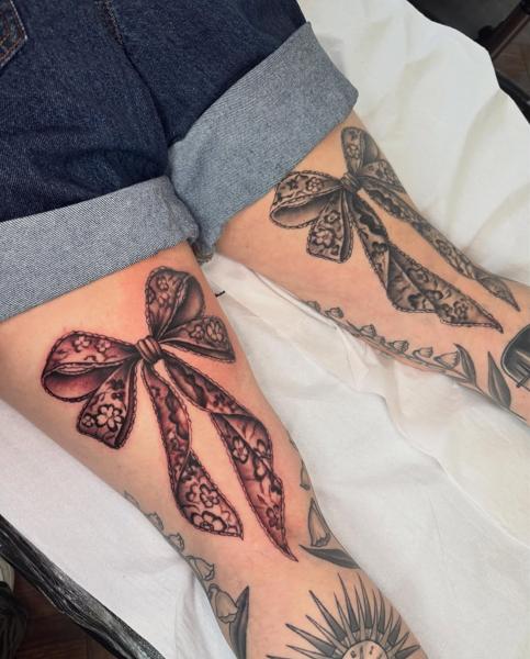 Realism lace bow tattoo by @paigehutchinson_tattoo