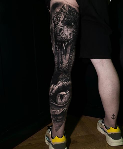 Realism dinosaur portrait tattoo by @dast.one
