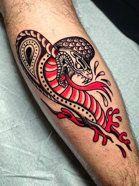 Traditional snake tattoo by @panosntolas
