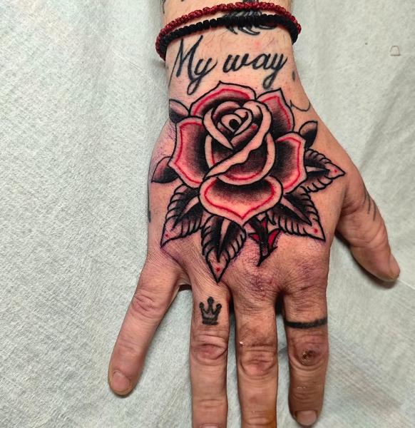 Traditional rose tattoo by @panosntolas