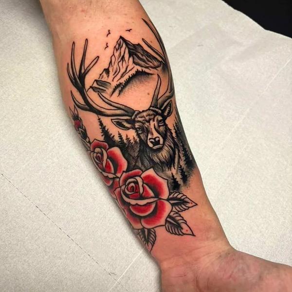 Traditional deer and roses tattoo by @panosntolas