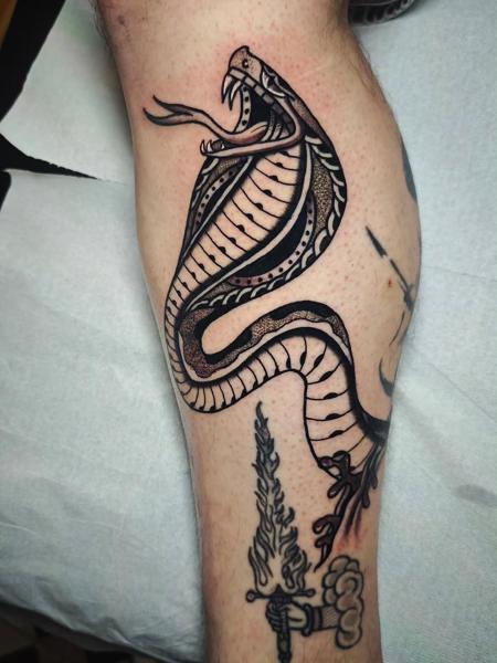 Blackwork decorative cobra tattoo by @panosntolas