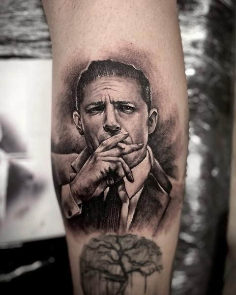 Realism smoking man portrait tattoo by @panayiotis_so