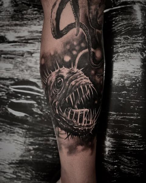 Realism anglerfish octopus tattoo by @panayiotis_so