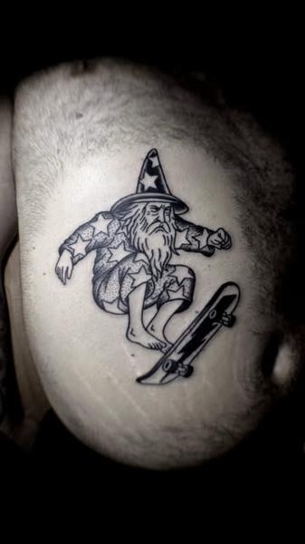 Illustrative wizard skateboarder tattoo by @stonerstattoo