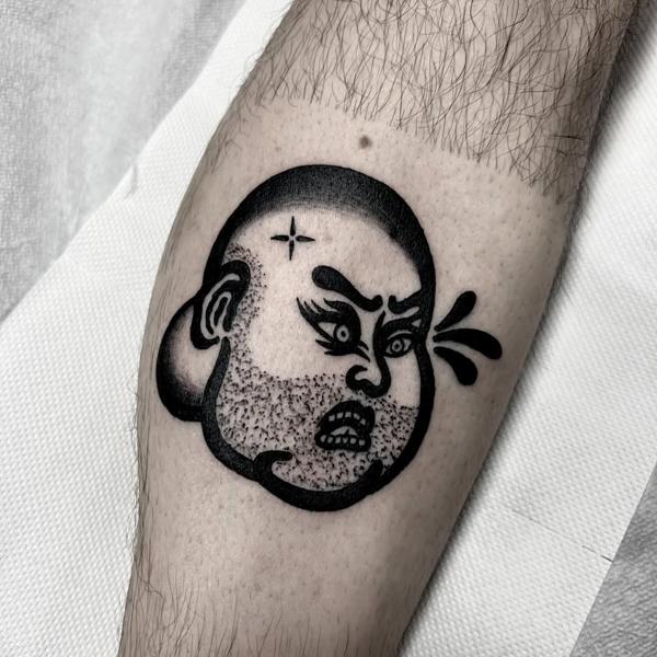 Traditional crying face tattoo by @stonerstattoo