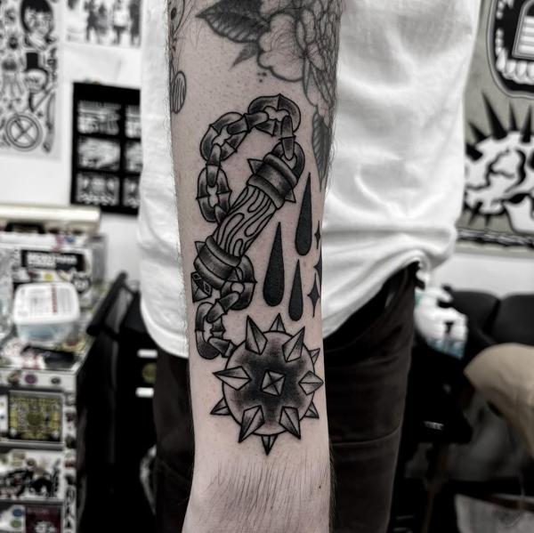 Traditional mace weapon tattoo by @stonerstattoo