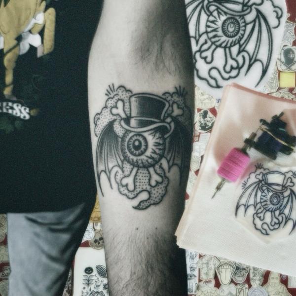 Traditional eyeball bat tattoo by @stonerstattoo
