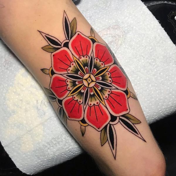 Traditional traditional flower tattoo by @ksr_junx
