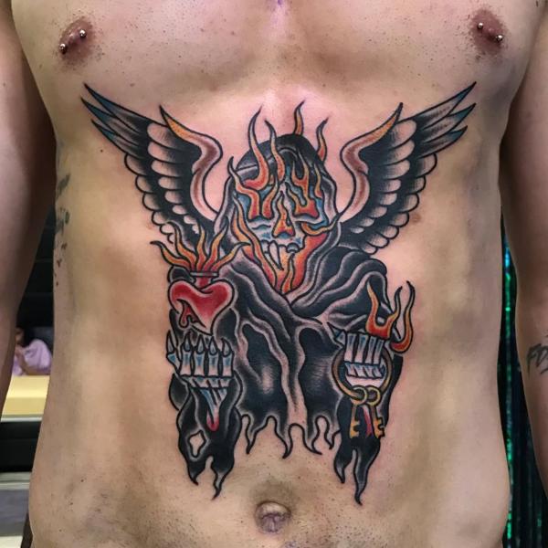 Traditional flaming skull tattoo by @ksr_junx