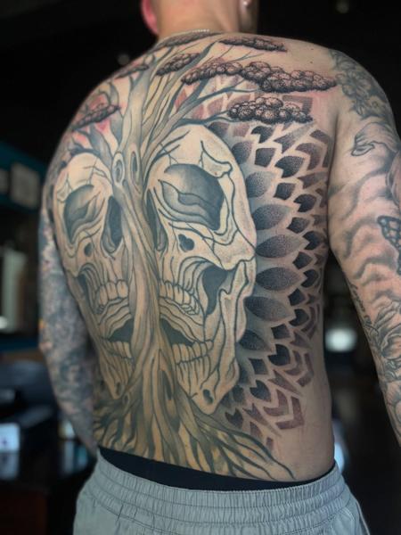 Blackwork tree skulls tattoo by @parispamelatattoo