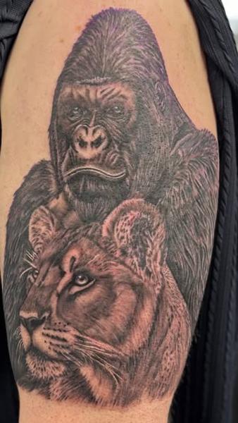 Realism gorilla lioness tattoo by @mrdbtattoo