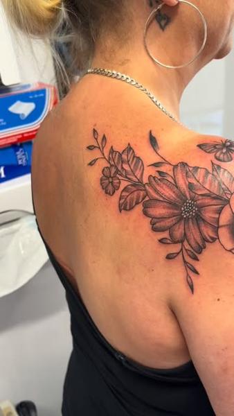 Blackwork floral cluster tattoo by @mrdbtattoo