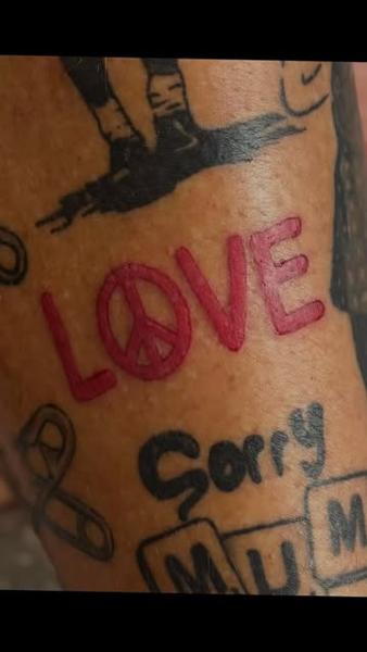 Lettering love peace sign tattoo by @mrdbtattoo
