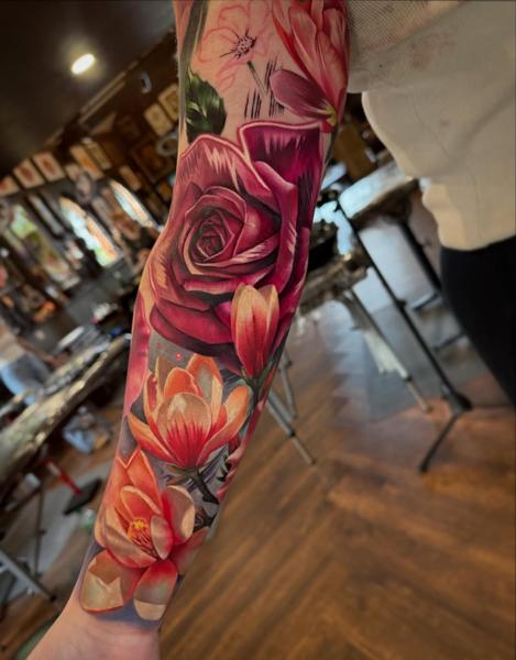 Realism floral sleeve tattoo by @k_peanut_