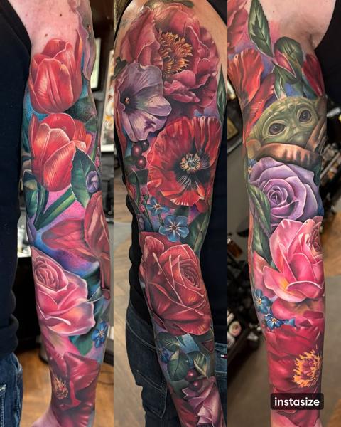 Realism floral sleeve tattoo by @k_peanut_