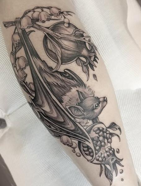 Blackwork bat and flowers tattoo by @penelopetentakles