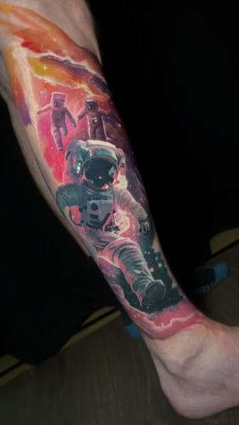 Realism astronauts in space tattoo by @lilpete_tattoo