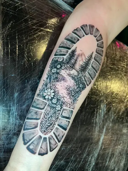 Illustrative blackwork boot print landscape tattoo by @philmoody_tattoos