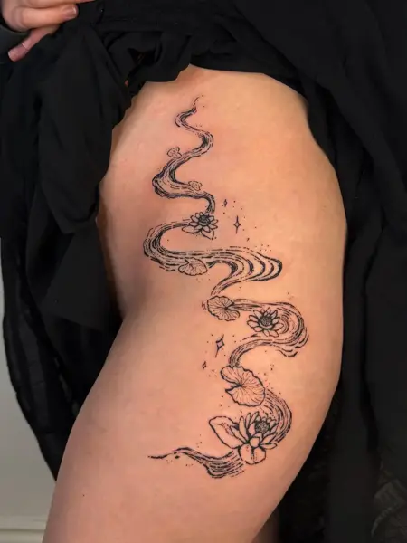 Fine line flowing water lilies tattoo by @artbymateospi