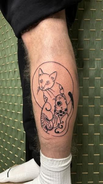 Fine line cat and skull tattoo by @buggietattoostudio