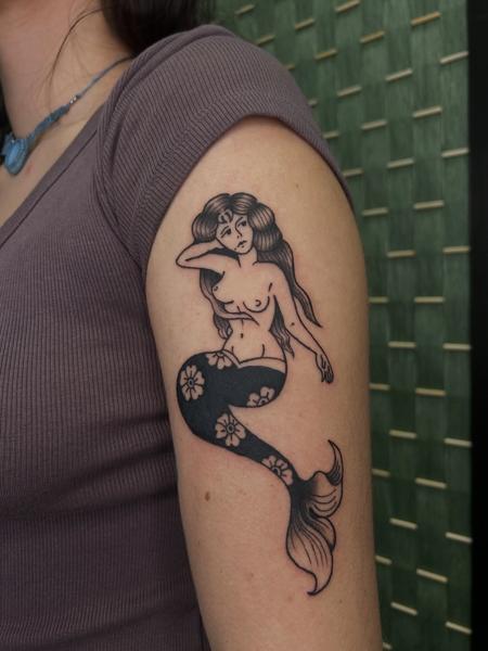 Traditional mermaid tattoo by @buggietattoostudio