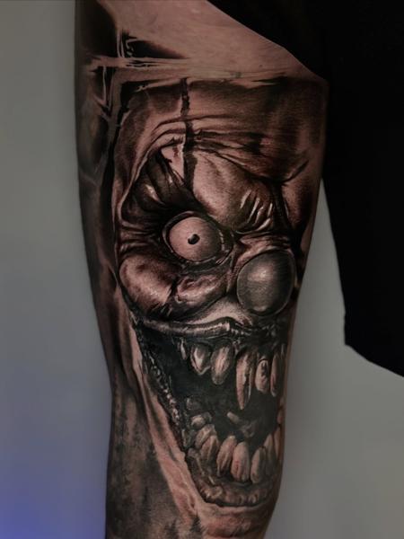 Realism creepy clown tattoo by @plamenkozarov