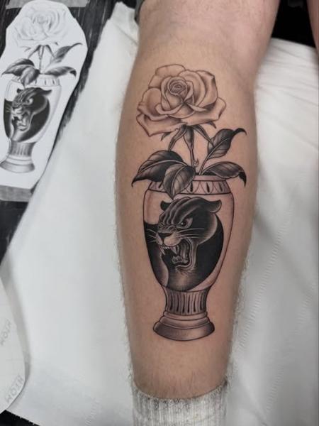Blackwork panther vase tattoo by @polishpollytattoo