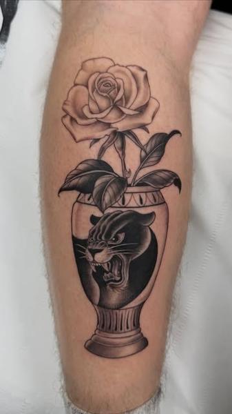 Blackwork panther vase tattoo by @polishpollytattoo