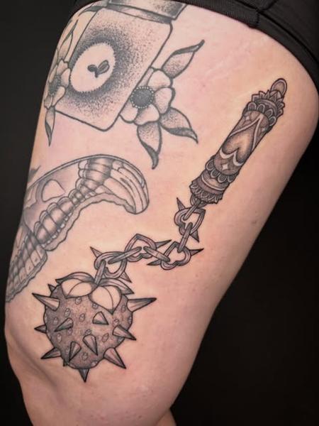 Blackwork mace weapon tattoo by @poppyoliviatattoo