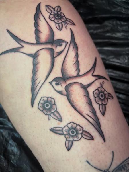 Traditional swallows and flowers tattoo by @poppyoliviatattoo