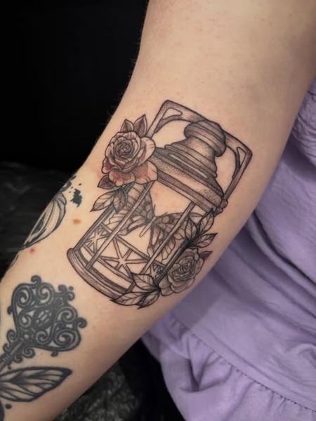Fine line lantern with roses tattoo by @poppyoliviatattoo
