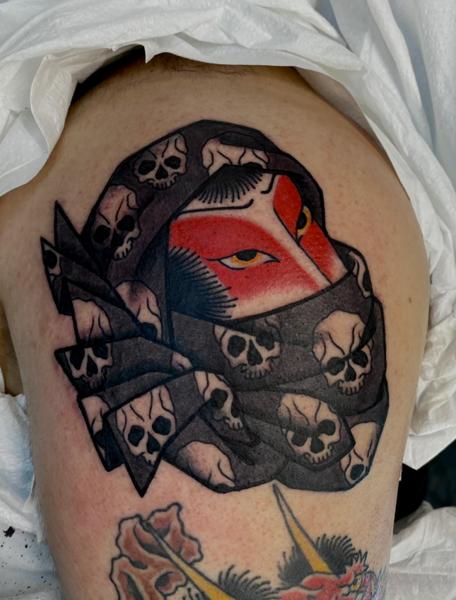 Traditional masked figure tattoo by @prisoner.of.love