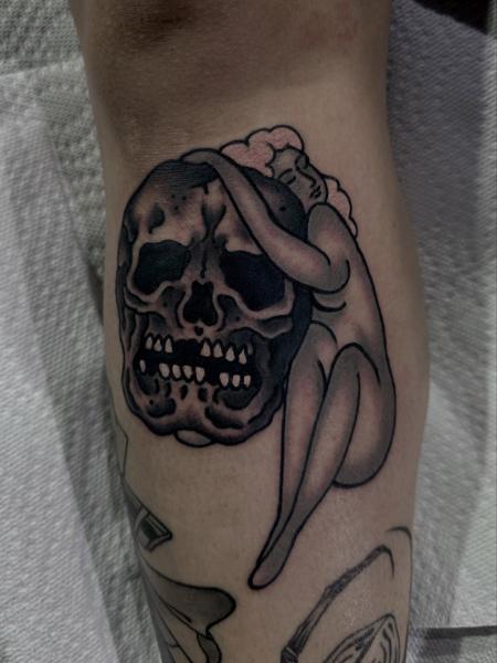 Blackwork woman hugging skull tattoo by @prisoner.of.love