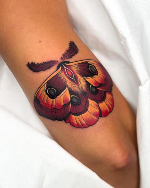 Traditional moth tattoo by @psyhiskond
