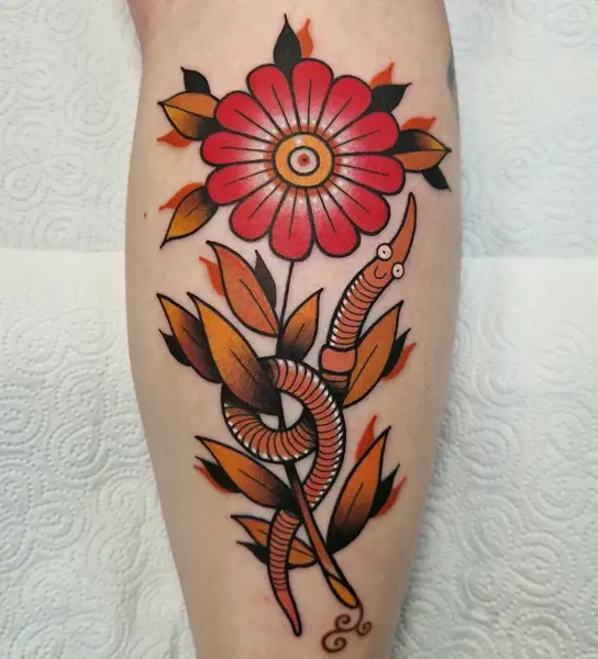 Traditional flower and snake tattoo by @rabtattoo