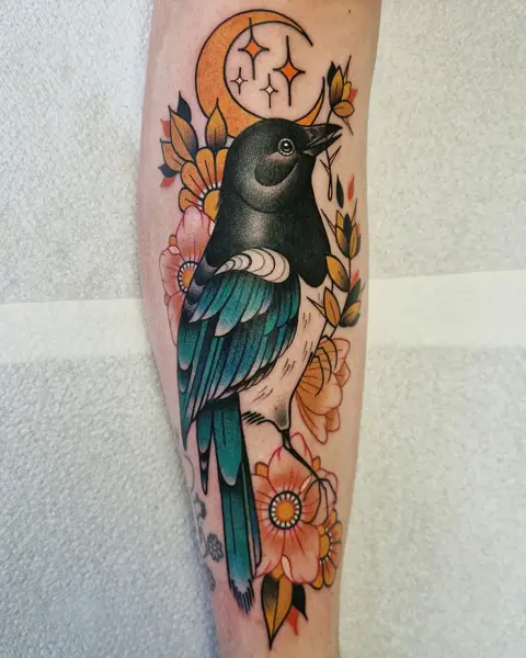Traditional bird and flowers tattoo by @rabtattoo