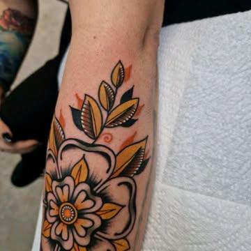 Traditional traditional flower tattoo by @rabtattoo
