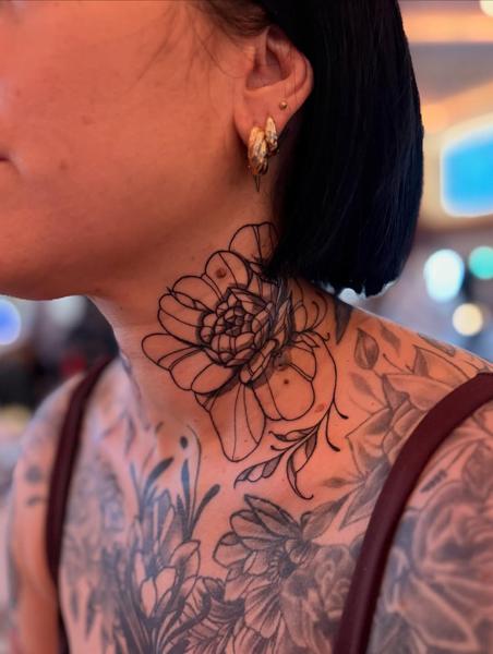 Fine line floral neck tattoo by @bramblestattoos