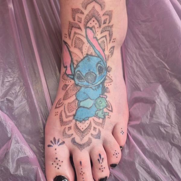 Anime stitch character tattoo by @rachaelmarie.floraink