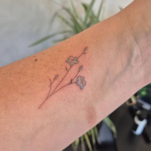 Fine line delicate flowers tattoo by @rachaelmarie.floraink