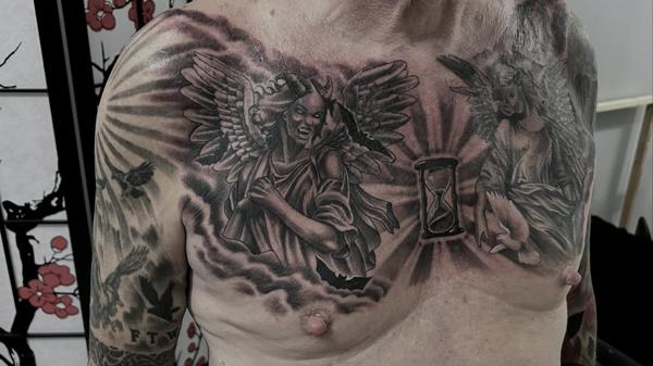 Dark realism angel demon hourglass tattoo by @rafaels_art_and_tattoo