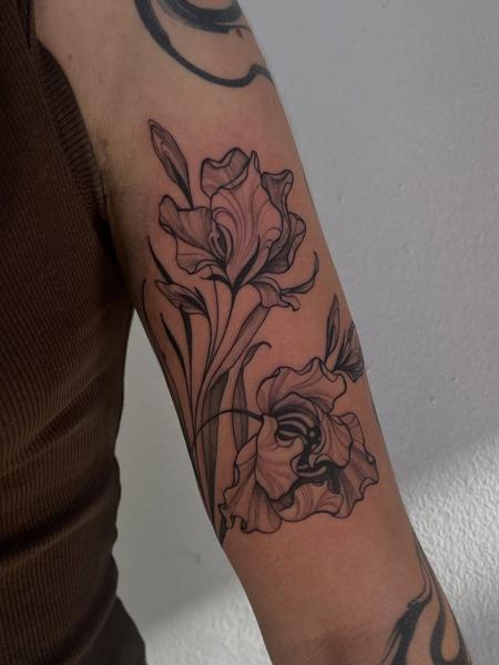 Fine line floral design tattoo by @raniatattoos