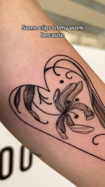 Fine line floral heart tattoo by @raniatattoos