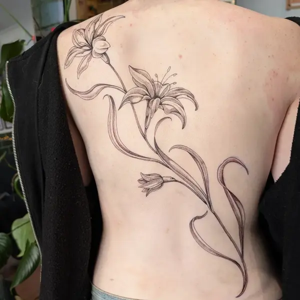 Fine line floral design tattoo by @inkleigh.tattoo