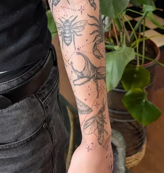 Fine line insect collection tattoo by @inkleigh.tattoo