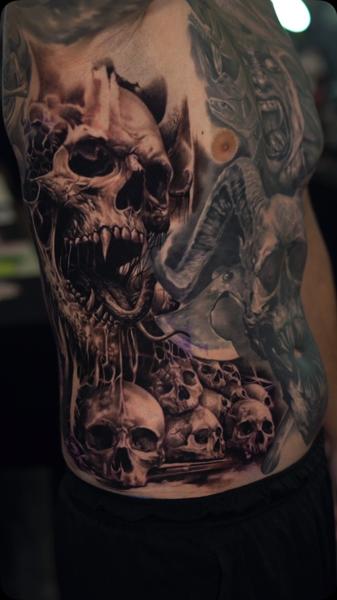 Realism skull collage tattoo by @razvanand